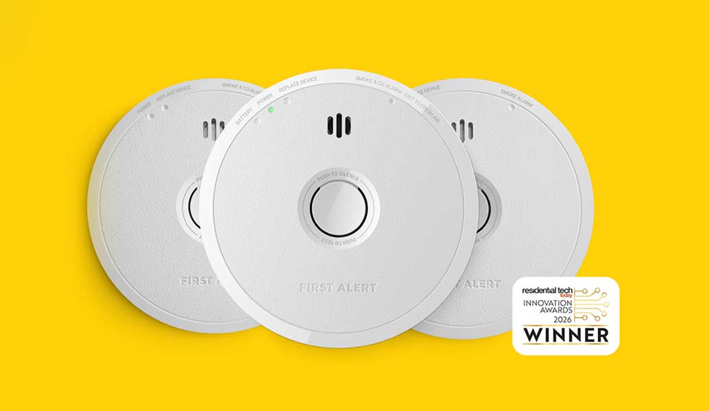 Three white circular smoke detectors arranged in a fan shape on a bright yellow background, with a Residential Tech Innovation Award Winner badge in the bottom right corner.